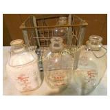 CRATE (4) GALLON FARMERS DAIRY BOTTLES