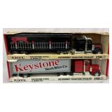 Two ERTL 1/25 Scale Peterbilt Tractor Trailers wit