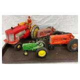 Four Die-Cast Toy Tractors with Driver Figure