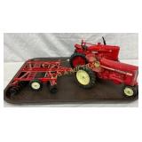 Two 1/16 Scale Die-Cast Farmall Tractors with Disk