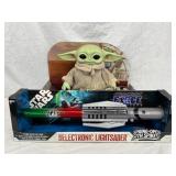 Two Star Wars Toys: Grogu Figure and Electronic Li