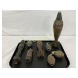 8 Inert WW2 Ordnance Items on Black Tray 8 Inert WW2 Ordnance Items on Black Tray
