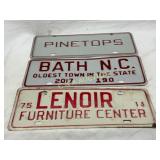 Three Embossed Metal City Tags, 1975, 2017, and Un