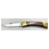 Buck Model 110 Folding Knife with Brass Bolsters a
