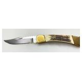 Buck 110 Folding Knife with Brass Bolsters and Sta