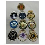 Ten Metal Bag Tags Featuring Various Logos and Des