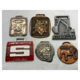 Six Metal Watch Fobs Featuring Various Brands and