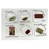 Six Collectible Advertising Buttons and Tags in Pa