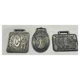 Three Michelin-Branded Metal Watch Fobs Featuring