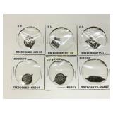 Six Embossed Metal Tobacco Tags in Holders