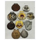 Ten Assorted Metal Tags and Emblems, Various Desig