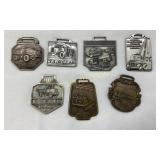 Seven Vintage Commemorative Heavy Equipment Brass