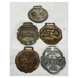 Five Early 20th Century Metal Watch Fobs Featuring