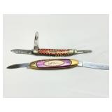 Two Folding Pocket Knives: Purina Branded and Purp