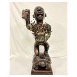 Wooden Carved Figure of a Kneeling Man with Nails