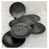 Seven 8 1/2-Inch Mirrored Black Pottery Plates by