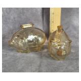 TWO IRIDESCENT AMBER GLASS SMALL PIGGY BANKS