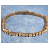 GOLD TONE STERLING SILVER LINKED TENNIS BRACELET