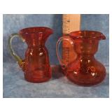 TWO ORANGE CRACKLE GLASS SMALL PITCHERS