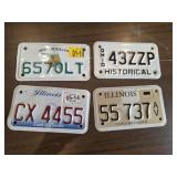 FOUR MOTORCYCLE LICENSE PLATES