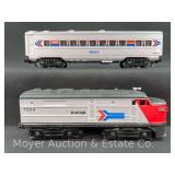 Unmarked No. 7004 Amtrak Diesel Locomotive (believed to be Lionel) and Lionel No. 16023 Passenger Car