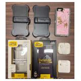 Group of OtterBox Iphone Cases with 2 New Pairs of Apple Earbuds