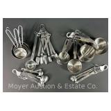 Group of Stainless Measuring Cups and Spoons