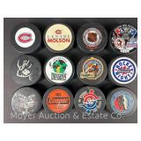 (12) Asst. Hockey Pucks