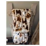Linen ladder with dog throws on it