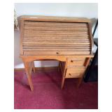 Small roll top desk. 34” high by 27” wide by 16” deep
