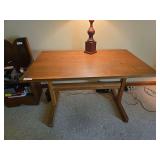 Vintage wood desk with simple traditional styling. Features a rectangular writing surface and open knee space. Suitable for office, study, or bedroom use.