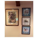 Framed migratory bird print and stamp display featuring John Ruthven signed artwork. Includes bird-themed prints and associated migratory bird stamps in a framed presentation. Wildlife and conservatio