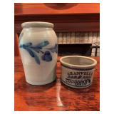 Two pieces of more modern stoneware pottery. Includes one larger handled crock or jar measuring approximately 10 in. x 7 in. and one smaller piece measuring approximately 4 in. x 7 in. Decorative ston
