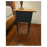 Pair of matching wooden side tables with traditional styling. Compact accent tables suitable for use beside a sofa, chair, or bed. Lamps shown are not included.