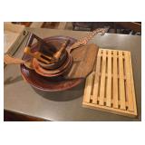 Wooden kitchenware as shown. Assorted group includes wood bowls, utensils, and related kitchen or serving pieces suitable for cooking, serving, display, craft use, or resale.