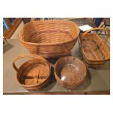 Four Longaberger baskets as shown. Assorted basket group with woven wood construction and traditional Longaberger styling, suitable for collecting, display, storage, gift baskets, or resale.