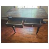 Antique wooden desk with traditional styling and multiple drawers. Features a writing surface with drawer storage and an aged finish consistent with use. Suitable for office, study, or decorative use.