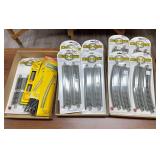 Assortment of Bachmann HO scale E-Z Track System nickel-silver track, including packaged straight and 18-inch radius curved sections, along with Atlas HO scale track as shown. Mixed packaged and loose