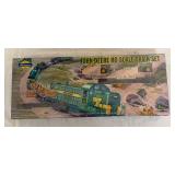 Athearn John Deere HO scale train set featuring an RSD locomotive, flatcars with John Deere tractors and crawlers, tank car and caboose. John Deere licensed set with farm-equipment themed rolling stoc