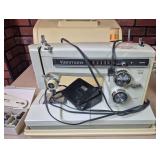 Kenmore Sewing Machine with Case & Accessories. Portable Kenmore sewing machine with multiple stitch settings, reverse control, foot pedal/power cord, accessory pieces and fitted carrying case.