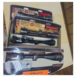 Flat of four rifle scopes including two Tasco Pronghorn 3-9x32mm scopes, a Weaver scope and a Field & Stream 4-16x50mm BDC reticle scope. Several remain in original packaging as shown.