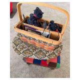 Two upholstered footstools and woven basket containing assorted decorative items as shown.