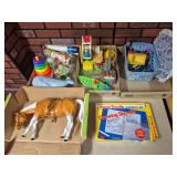 Assorted Vintage & Later Children’s Toys. Large mixed group includes plastic and wooden toys, Fisher-Price pieces, toy vehicles and figures, stacking rings, toy boat, large articulated horse, TYCO M