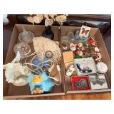 Two flats of miscellaneous household and desk items including decorative glass pieces, doilies, small figurines, Christmas pins and ornaments, butterfly-themed pieces and other items as shown.