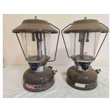 Pair of Coleman Model 275 Lanterns – Marked 10/81 & 9/79. Two brown-finish double-mantle lanterns with matching brown ventilators, clear globes and wire bail handles; show age-related wear, oxidatio
