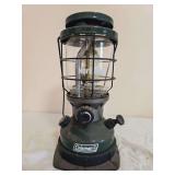 Coleman Model 2000 NorthStar Lantern – Marked 10/95. Green-finish pressure lantern with protective wire globe cage, clear NorthStar Coleman globe and large control knob; shows general age-related us