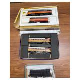 Group of HO scale locomotives including Bachmann Southern Pacific Daylight 4-8-4 steam locomotive with tender, two Boston & Maine No. 4266/4268 diesels and Pennsylvania No. 8274 diesel as shown. Mixed