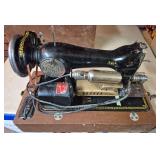Vintage Black Sewing Machine with Dayton Electric Motor & Case. Black portable sewing machine with gold floral decals, external Dayton electric motor and brown carrying case; shows age-related wear an