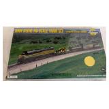 Athearn John Deere HO scale train set featuring John Deere-themed locomotive, rolling stock and two die-cast Anniversary 4010 tractors. Set is numbered 01220.
