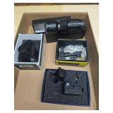 Group of assorted firearm sights and optics identified in the catalog as Primary Arms, AIM Sports, HQ Issue and NcStar. Includes red-dot/reflex-style sights and related mounts in boxes as shown.
